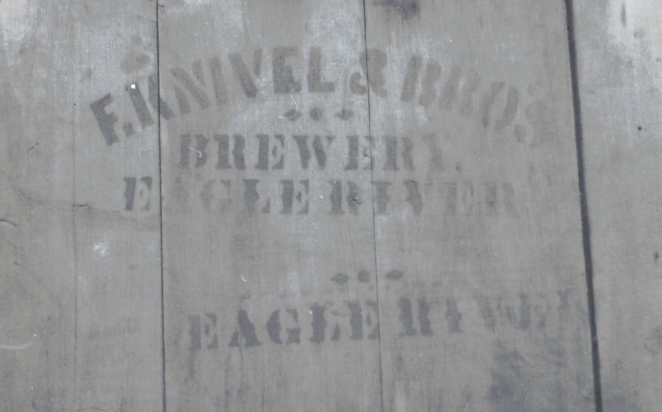Remains of sign on the door of the Knivel Brewery<br>Photograph taken by the Copper Country Bottle Collectors in the early 1970s